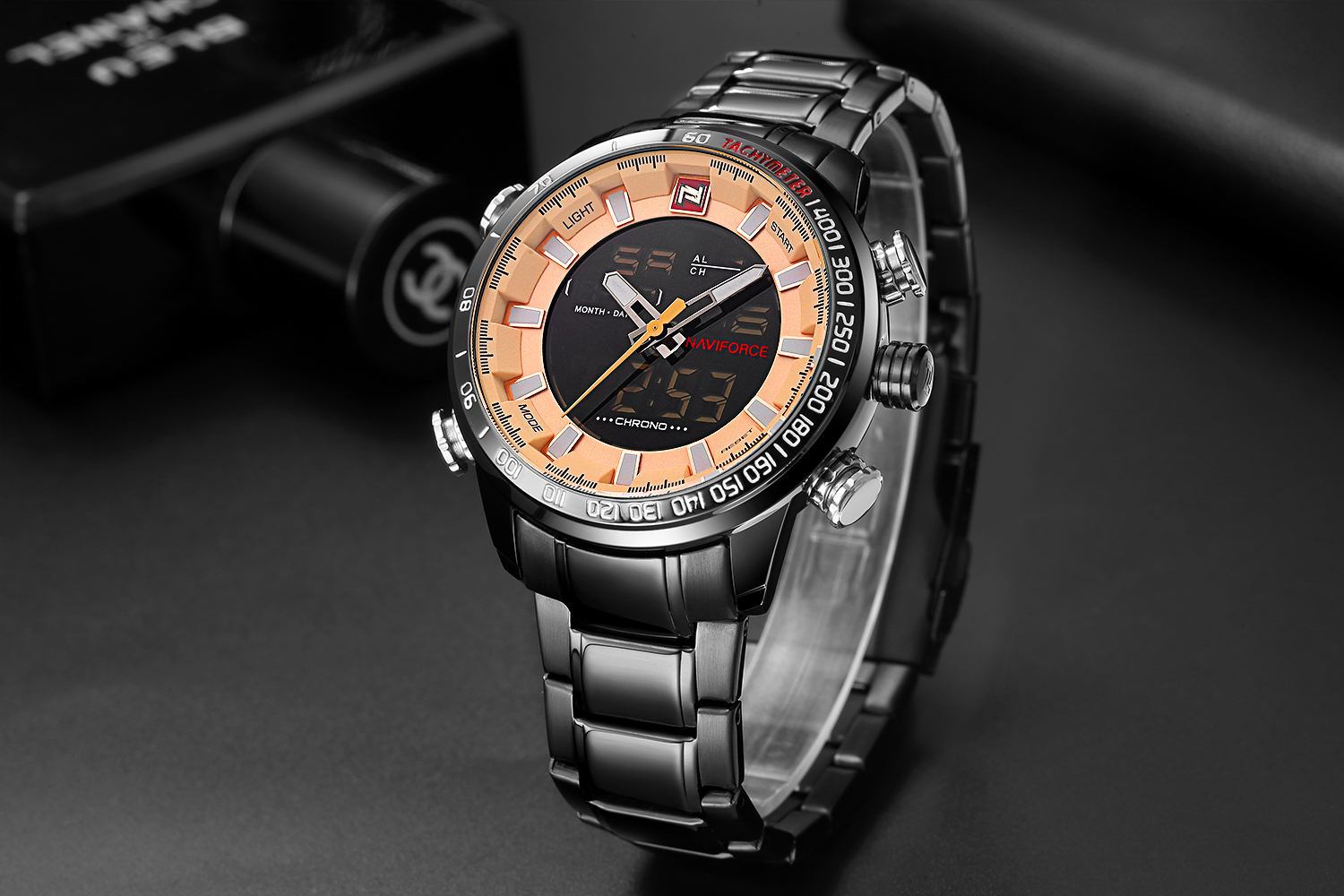 Wristwatch with digital and analog display on a dark background