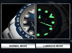 Comparison of a watch in normal mode and luminous mode on a dark background.