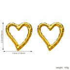 Retro gouden oorbellen in eenvoudige lavavorm met hartvorm