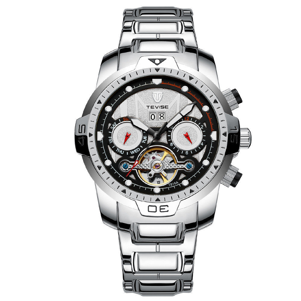 A silver mechanical watch with a patterned dial, stainless steel band, and a spiral crown.