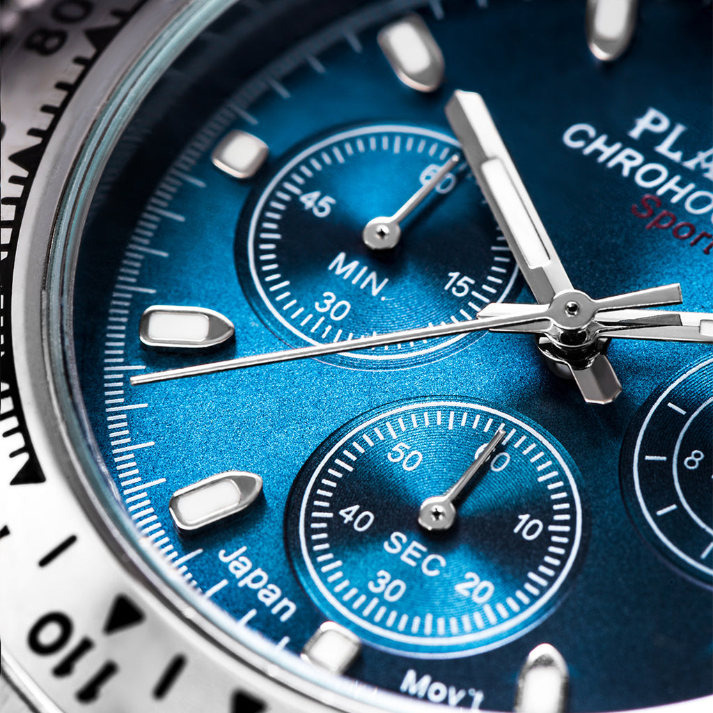 Close-up of a blue watch face with silver accents
