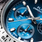 Close-up of a blue watch face with silver accents