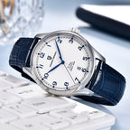 Watch with blue strap on a white keyboard