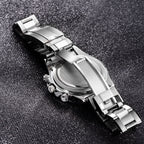 Silver watch with a detailed band on a textured black surface
