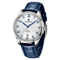 A blue mechanical watch with a round dial, stainless steel case, pin buckle, and a blue leather strap.