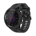 A black smartwatch with a silicone strap and a digital display showing the time and various smart watch features.