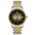A men's mechanical watch with a silver stainless steel band and a round dark dial with roman numerals and a date display.