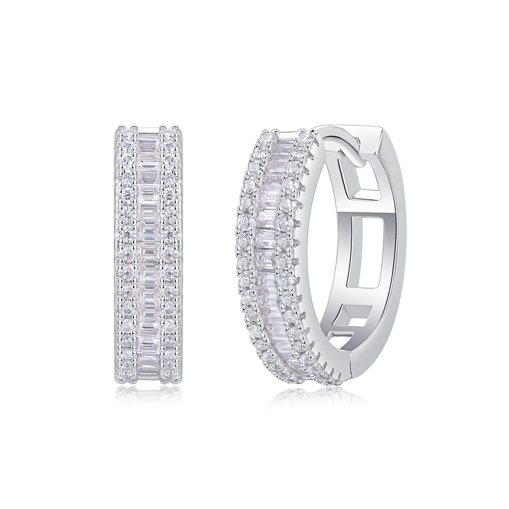 A pair of silver diamond earrings with a woven pattern and inlaid with small round diamonds.