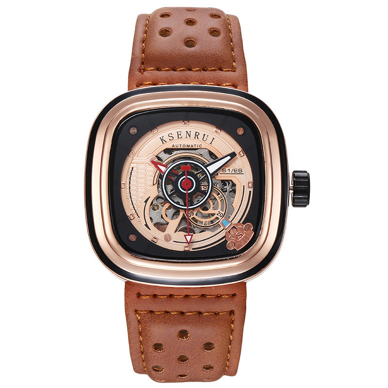 A black and rose gold mechanical watch with a perforated leather strap and a skeleton dial.