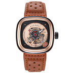 A black and rose gold mechanical watch with a perforated leather strap and a skeleton dial.