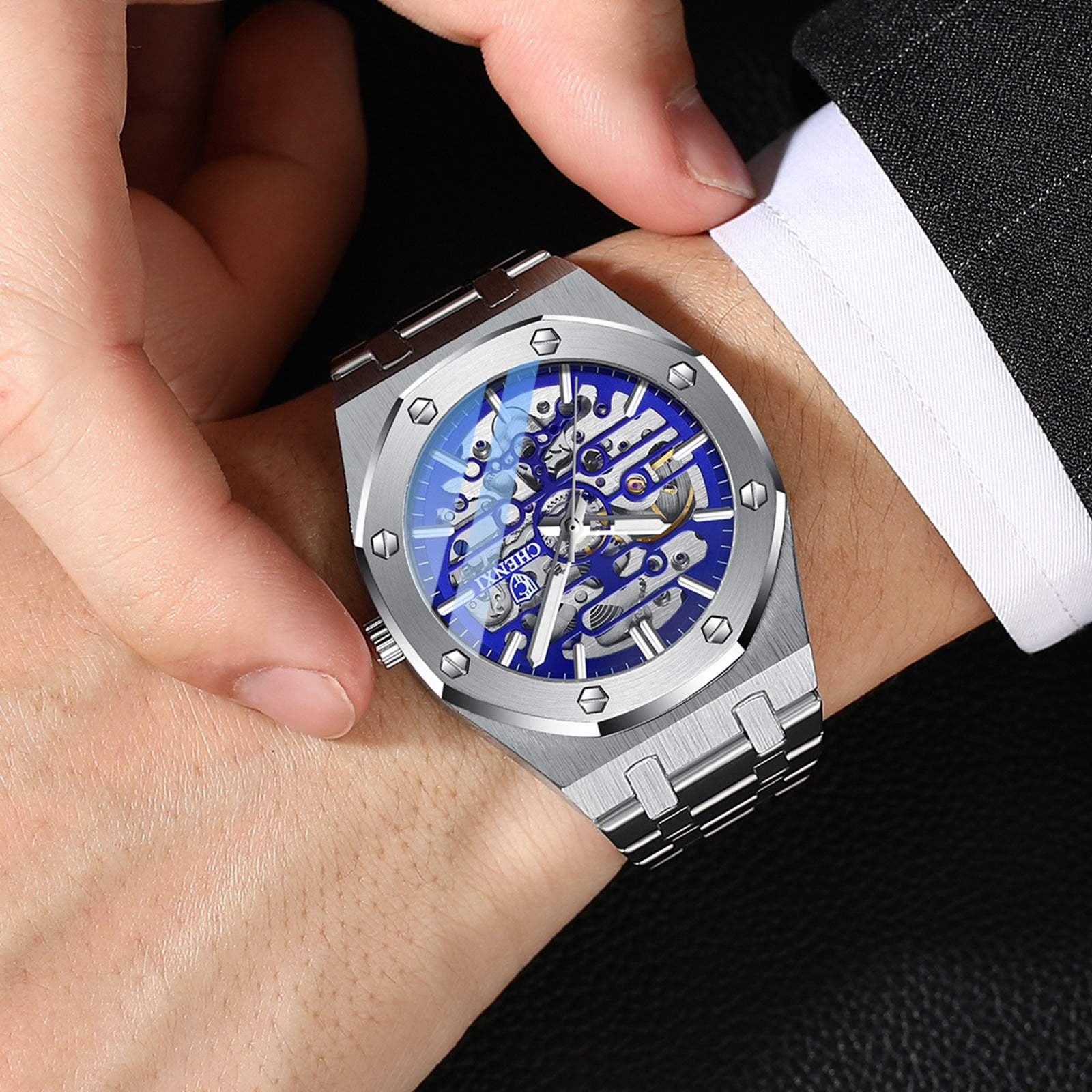 Orologi da polso meccanici automatici da uomo con lancette luminose e cinturino in acciaio inossidabile, quadrante scheletrato
