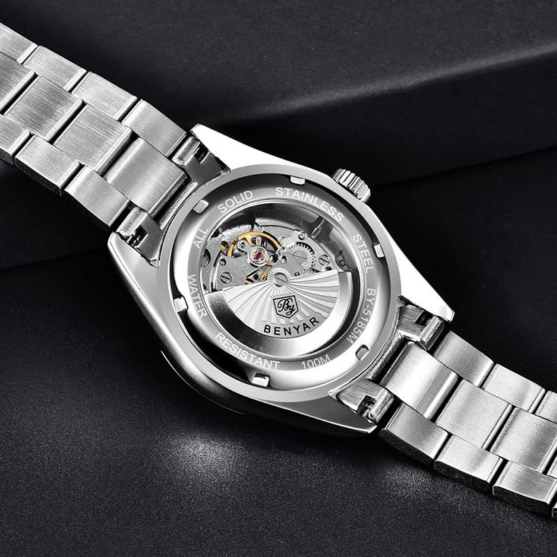Silver wristwatch with visible brand name on a dark background