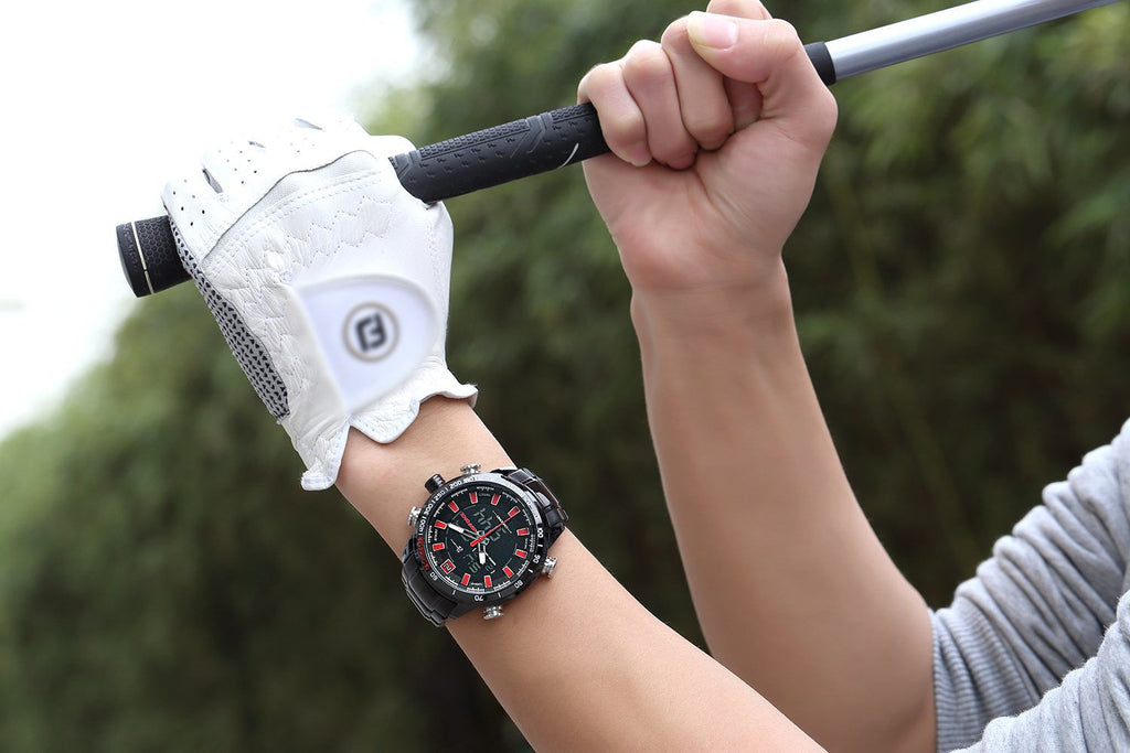 Person holding a golf club with a white glove and a watch on wrist, blurred green background