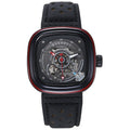 A black and rose gold mechanical watch with a perforated leather strap and a skeleton dial.