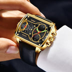 Luxury watch with gold case and black strap worn on wrist
