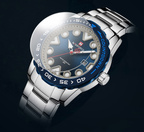 Silver watch with blue bezel on a black background