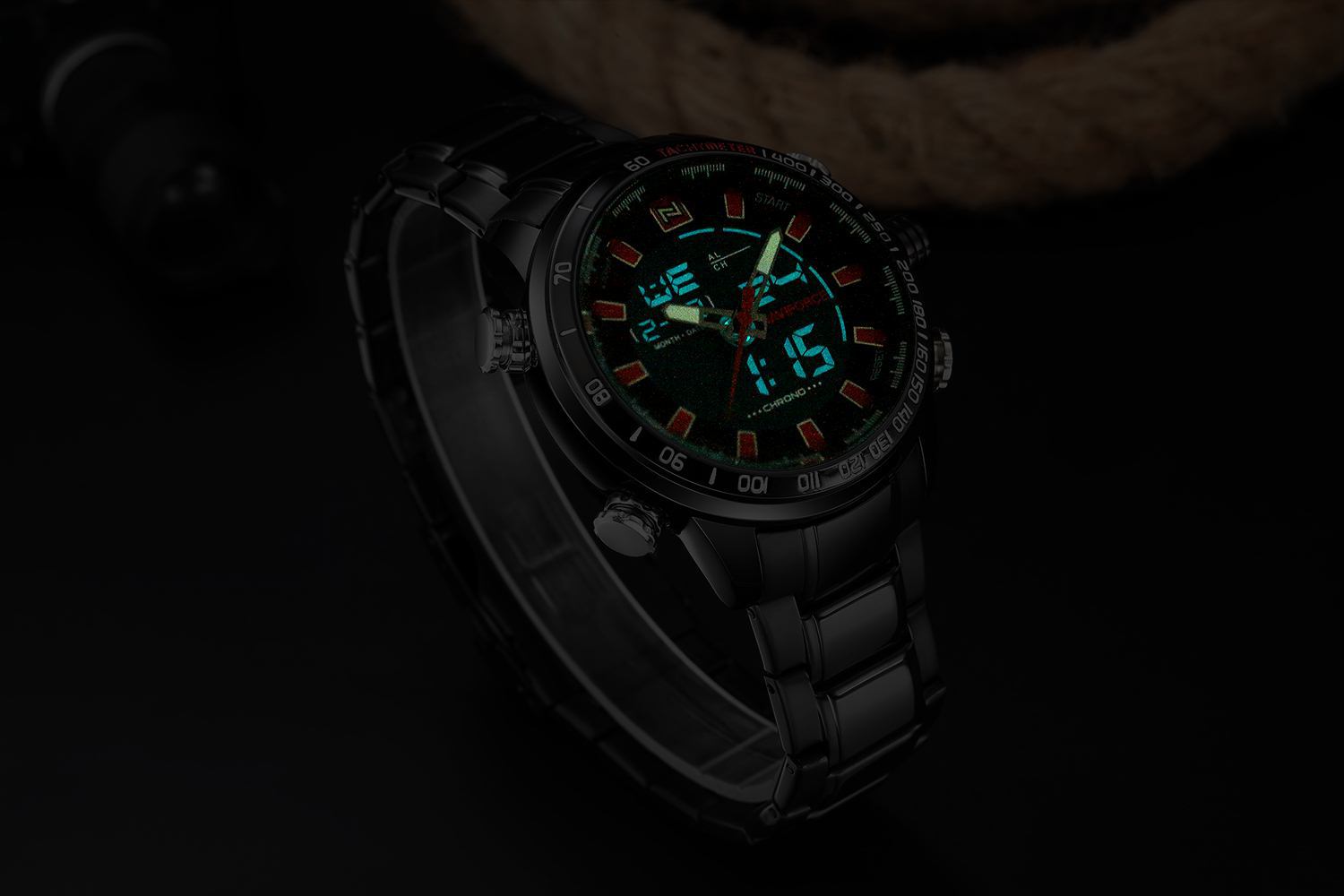 Black digital watch with a dark background