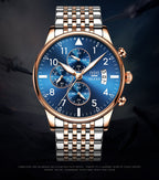 Luxury watch with blue dial and rose gold case on a dark background