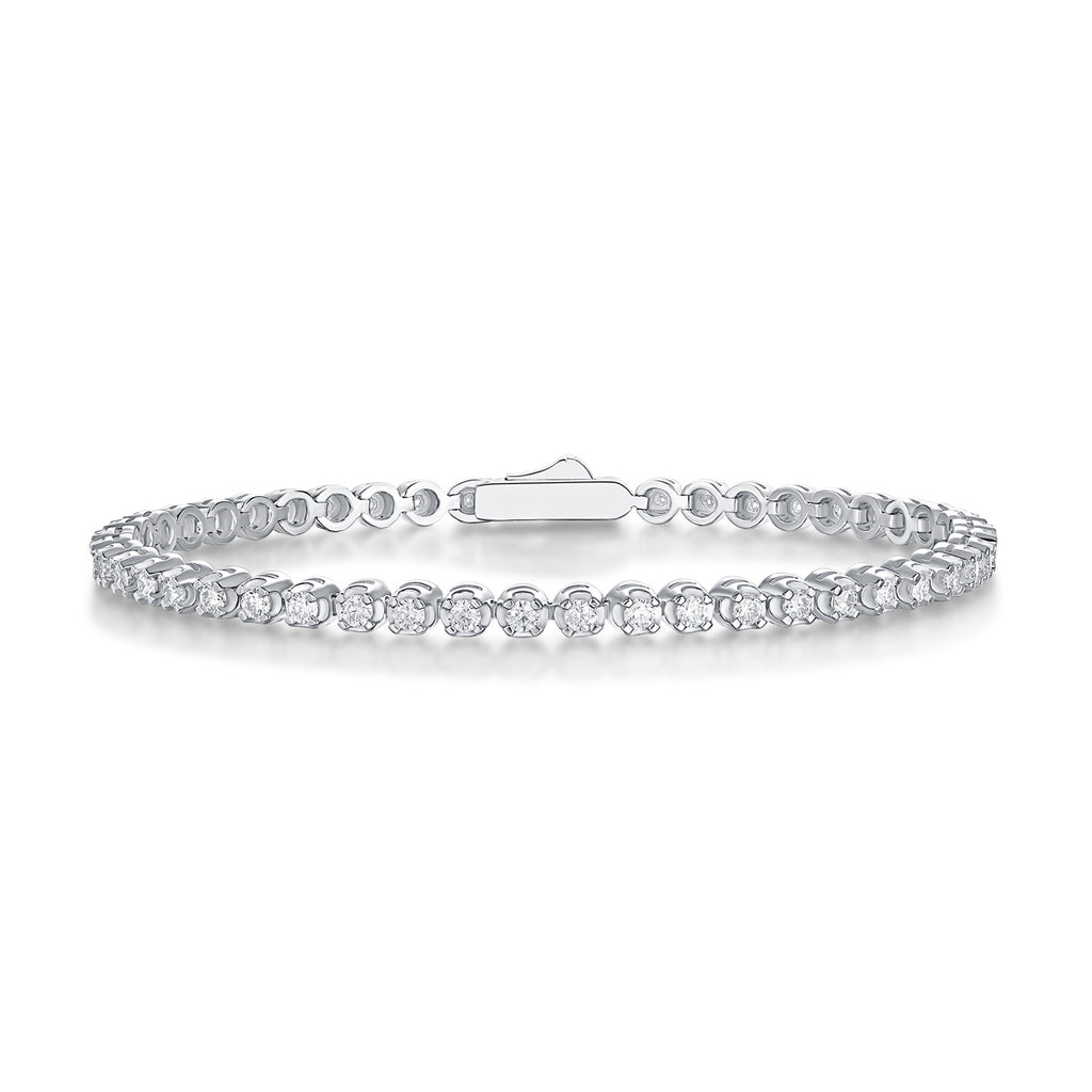 A tennis bracelet featuring silver color and adorned with diamonds.