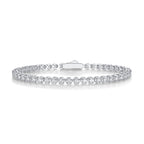 A tennis bracelet featuring silver color and adorned with diamonds.