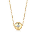 A gold-colored necklace with a spherical pendant featuring a diamond in the center, suspended on a chain.